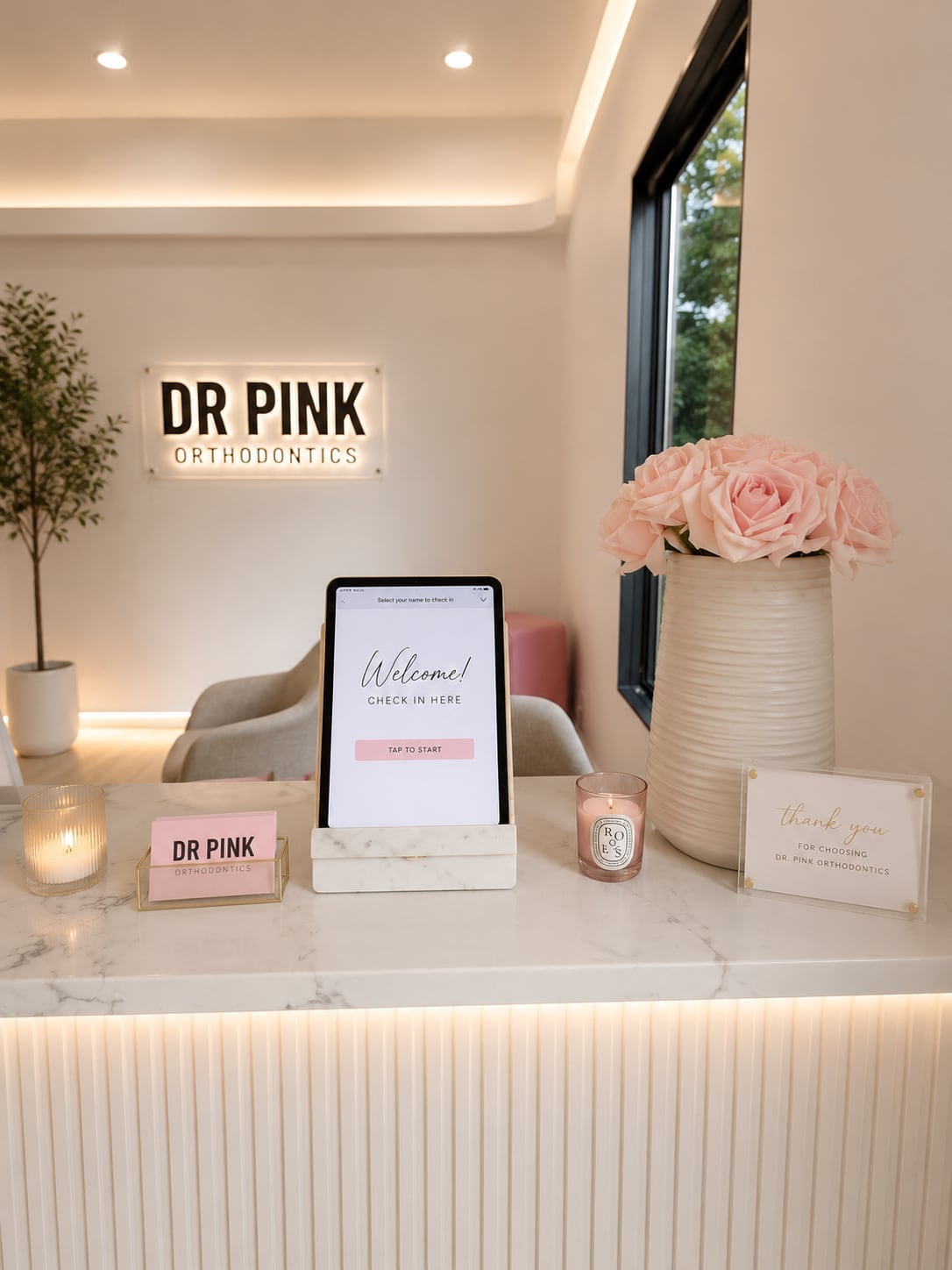 Check-in desk with flowers at Dr. Pink Orthodontics